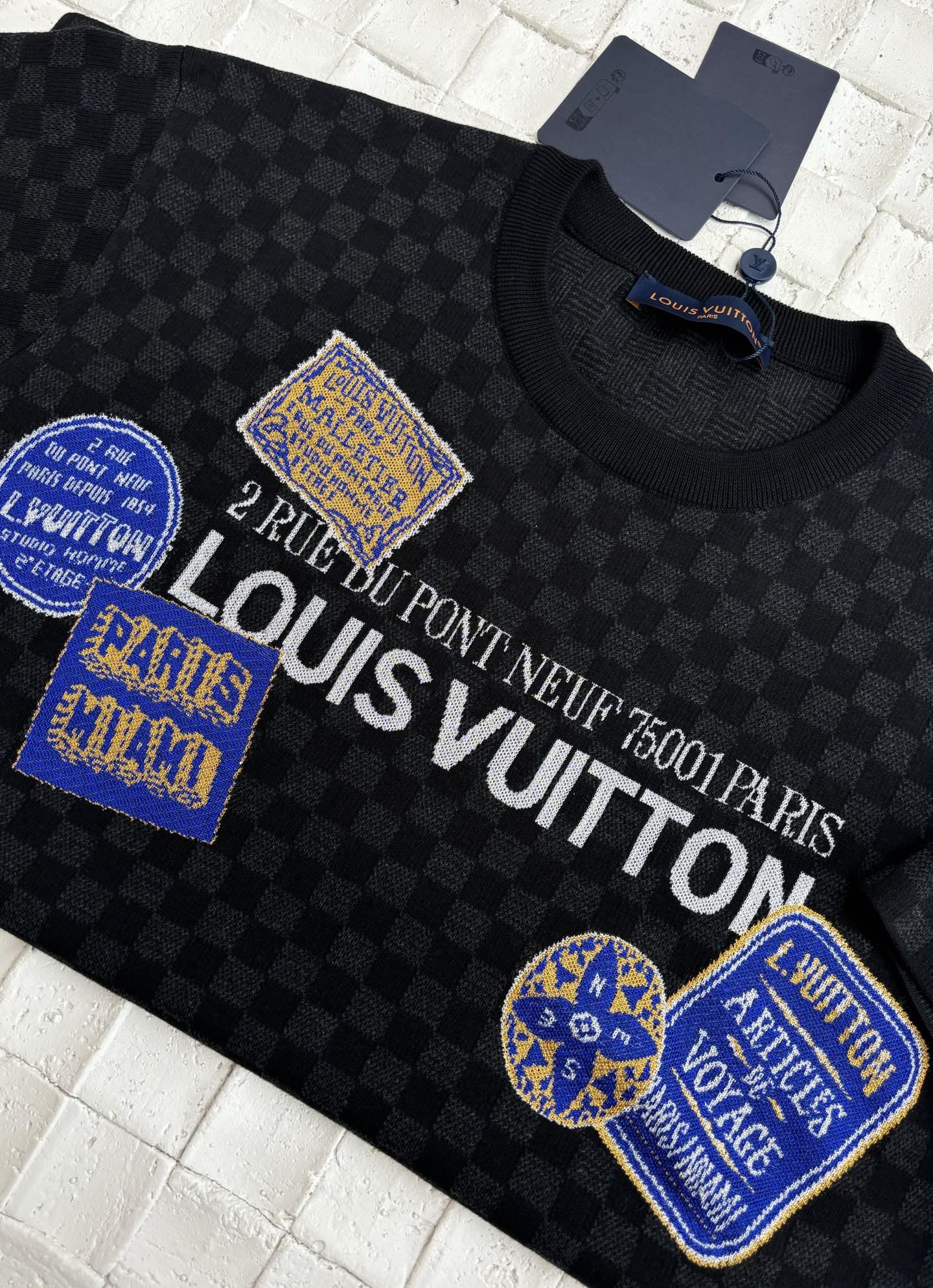 Louis Vuitton checkered knit polo with large logo text and blue patches