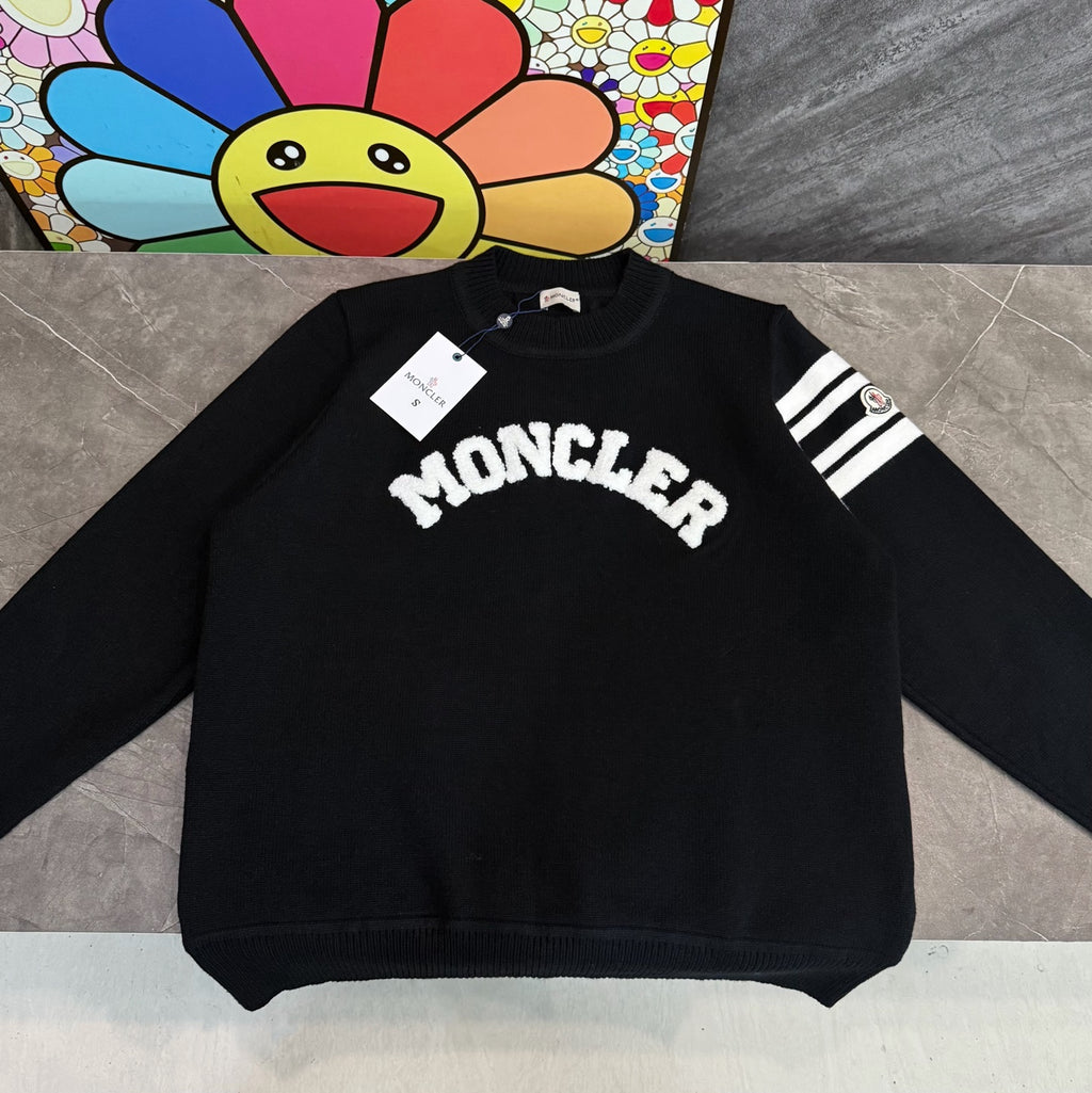 Moncler black long-sleeve sweatshirt with white logo and striped sleeve detail