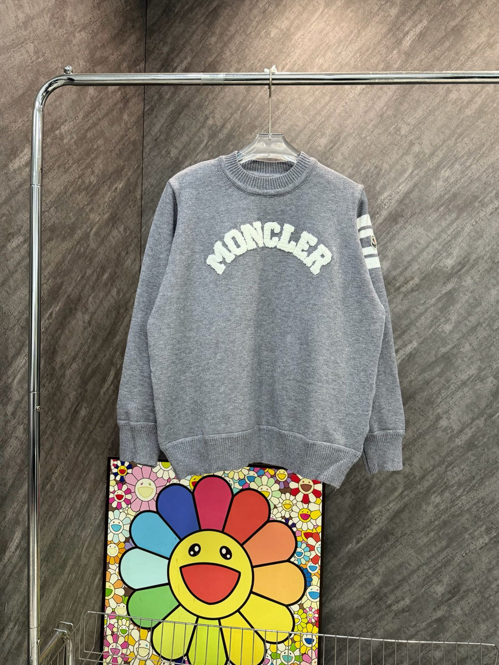 Light gray crewneck long-sleeve sweater with MONCLER graphic and striped sleeve detail