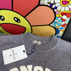 Light gray crewneck sweater neckline with Moncler tag and ribbed knit collar