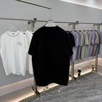 Prada short-sleeve T-shirt, black, front view on a clothing rack
