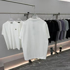 White short-sleeve T-shirt on display with Prada triangle badge