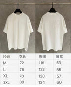 White Dior short-sleeve T-shirt with size chart showing M to 2XL