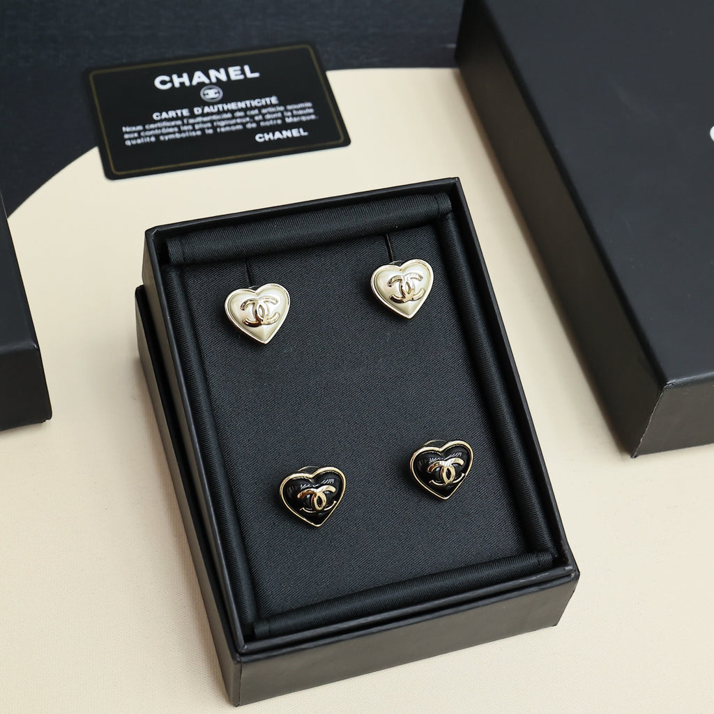 Chanel heart-shaped stud earring set in black display box with four pairs