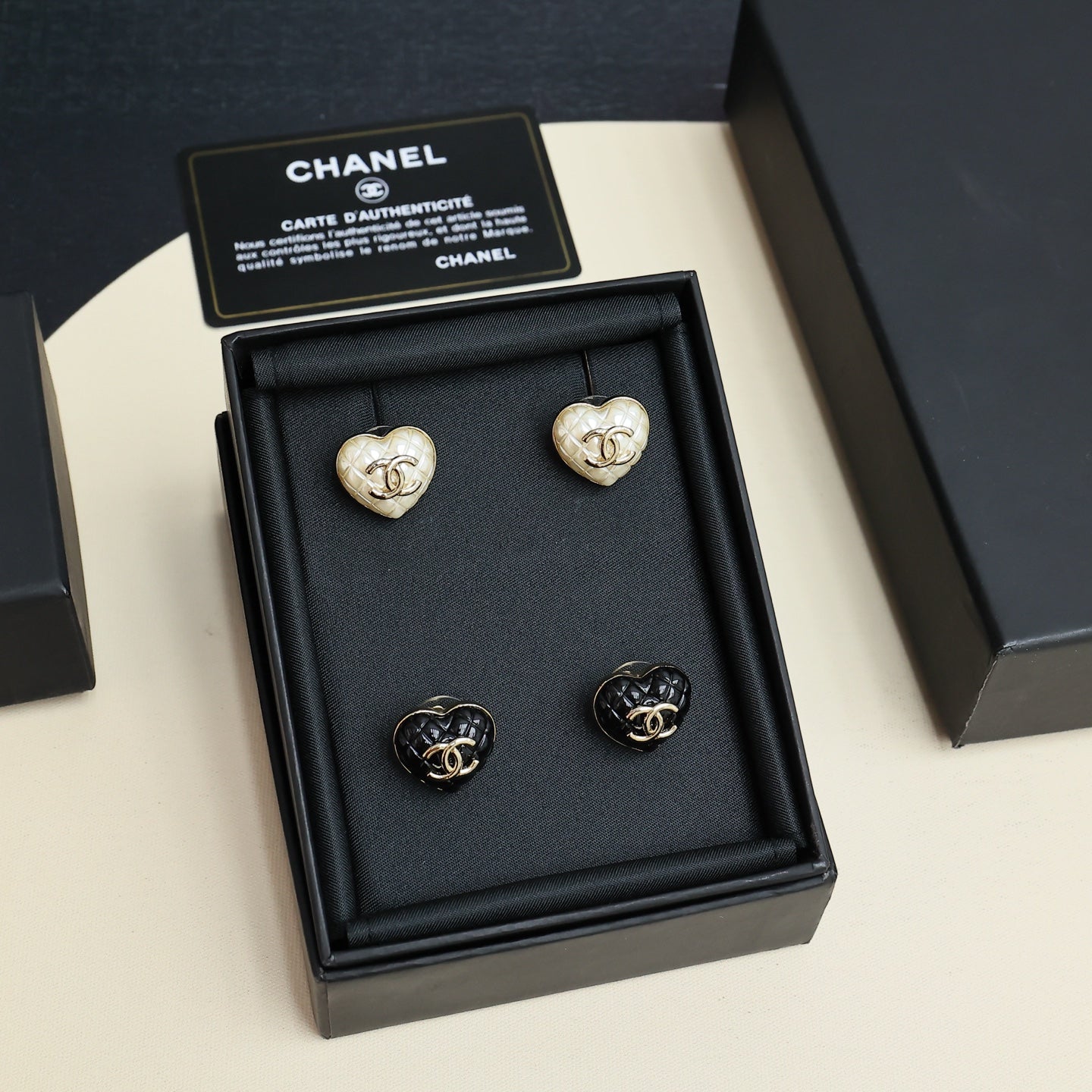 Chanel heart stud earrings set: two white and two black hearts, in box