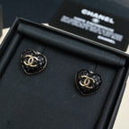 Chanel heart stud earrings: black enamel with gold CC logo, in box