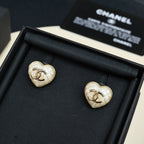 Chanel heart stud earrings: white heart with gold CC logo, in black box