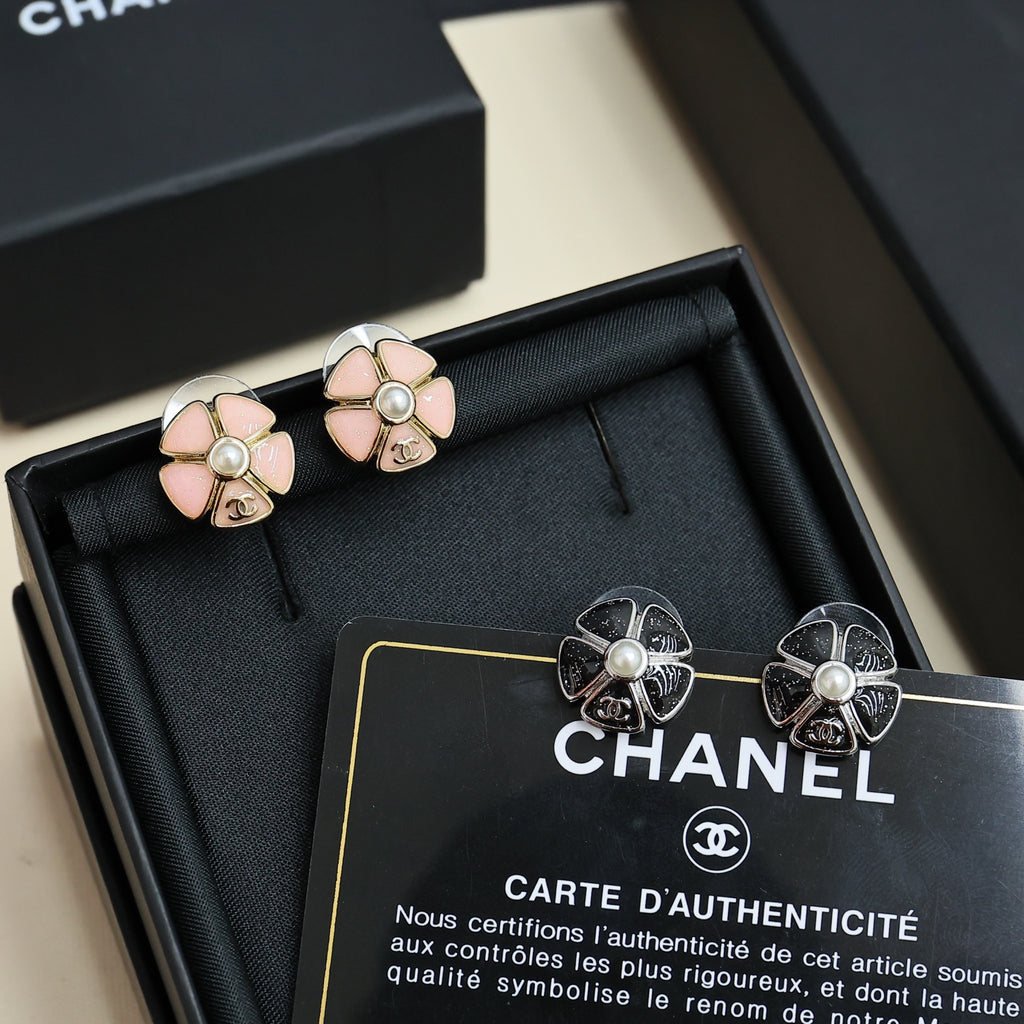 Chanel floral stud earrings with pale pink petals and pearl, silver-tone backs