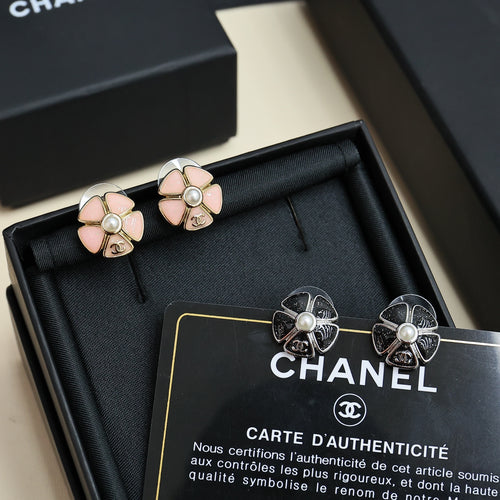 Chanel floral stud earrings with pale pink petals and pearl, silver-tone backs