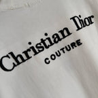 White Christian Dior T-shirt close-up of “Christian Dior” script logo