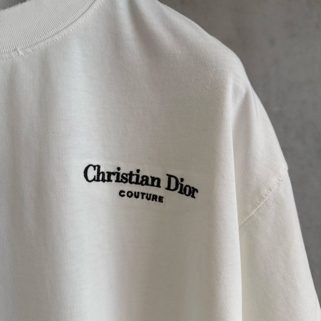 White Christian Dior T-shirt with “Christian Dior Couture” logo on upper chest