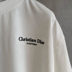 White Christian Dior T-shirt with “Christian Dior Couture” logo on upper chest