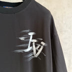 Louis Vuitton black T-shirt close-up of sleeve and centered white logo print