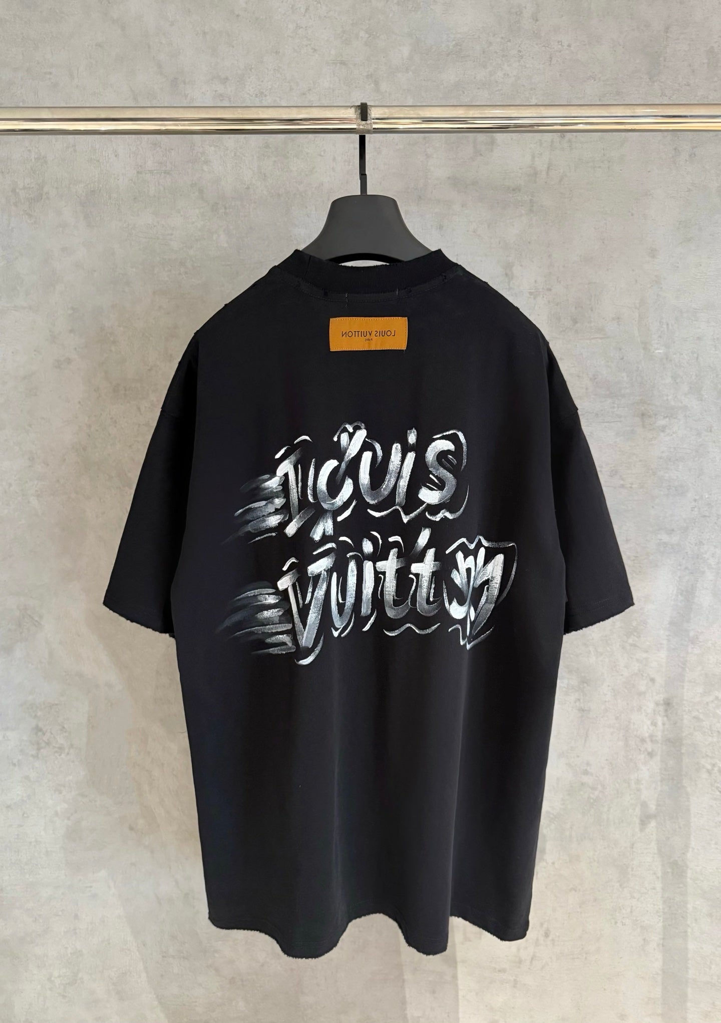 Louis Vuitton black short-sleeve T-shirt with graffiti-style logo on chest