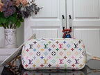 Designer tote bag with multicolor monogram print, rounded top and gold-toned hardware