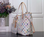 Designer tote bag with multicolor monogram pattern, top handles and side strap details