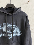 Dark gray Balenciaga hoodie with hood and front pocket; large white graphic print