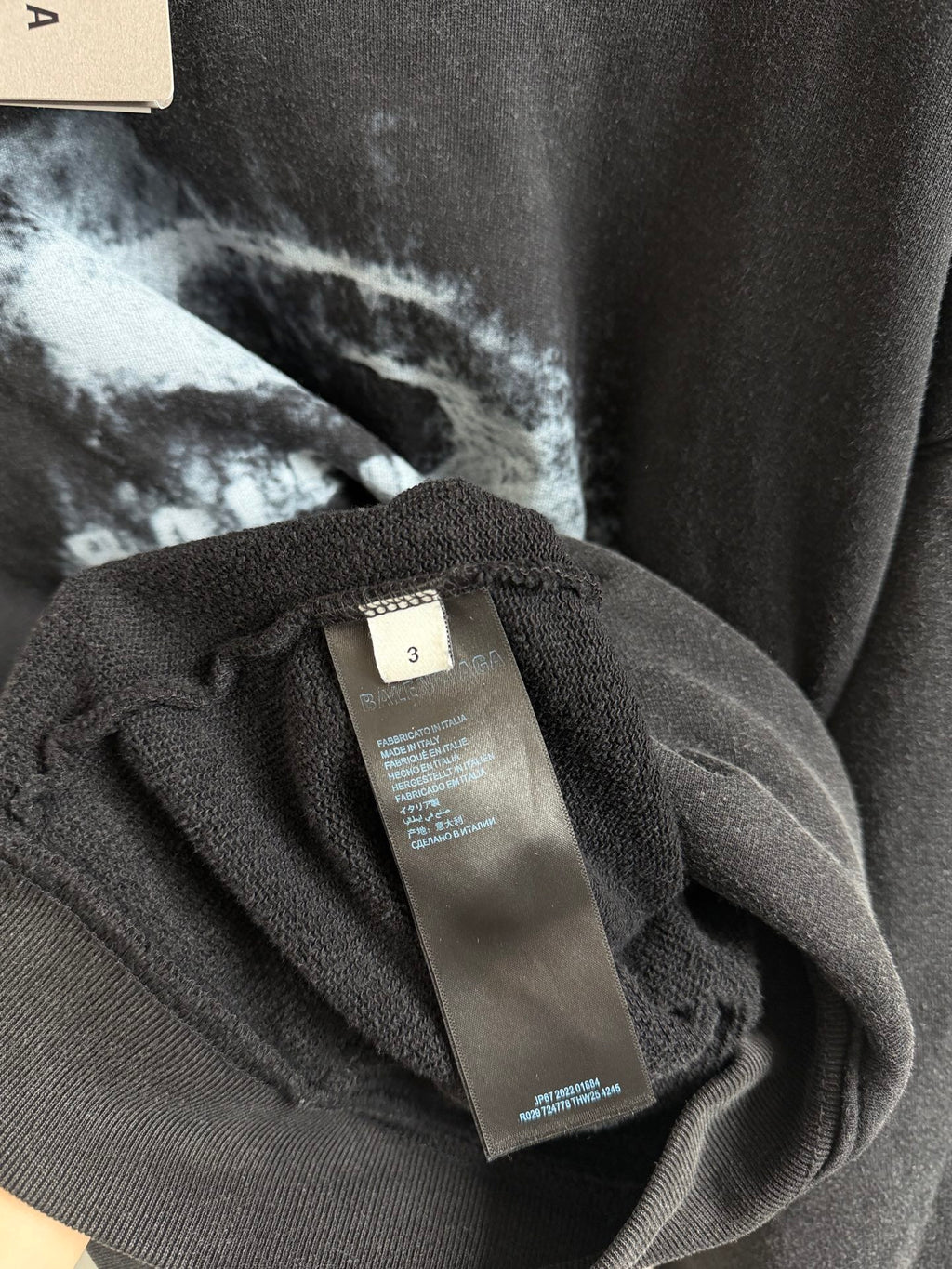 Hoodie care label on interior tag attached with Balenciaga branding