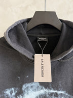 Balenciaga hoodie neckline with hood lining and visible Balenciaga hangtag