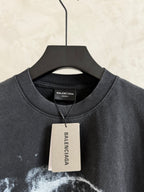 Balenciaga T-shirt collar with white hang tag, dark gray crewneck, short sleeves.