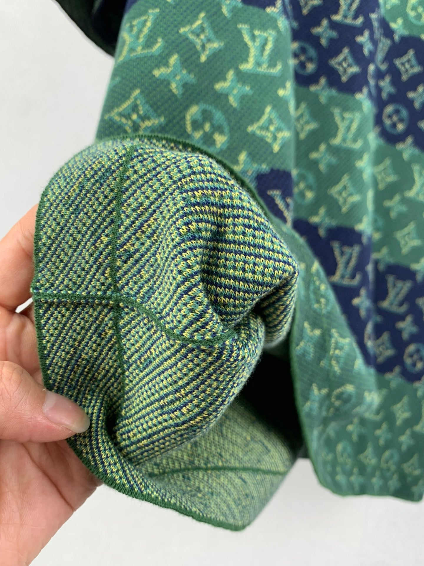 Louis Vuitton knit T-shirt knit cuff detail, green and navy monogram pattern.