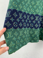 Louis Vuitton knit T-shirt hem corner with green and navy monogram pattern.