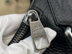 Louis Vuitton bag close-up of silver lock hardware on textured dark leather