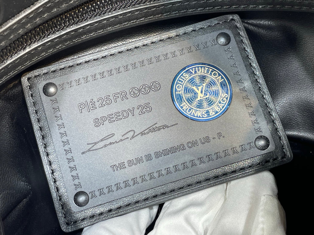 Louis Vuitton bag leather serial tag with Speedy 25 and blue logo seal