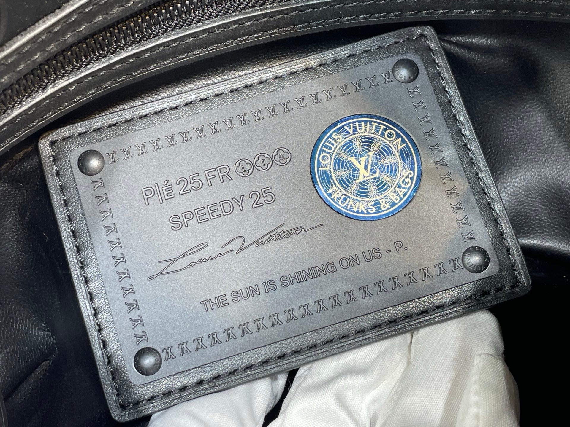 Louis Vuitton bag leather serial tag with Speedy 25 and blue logo seal