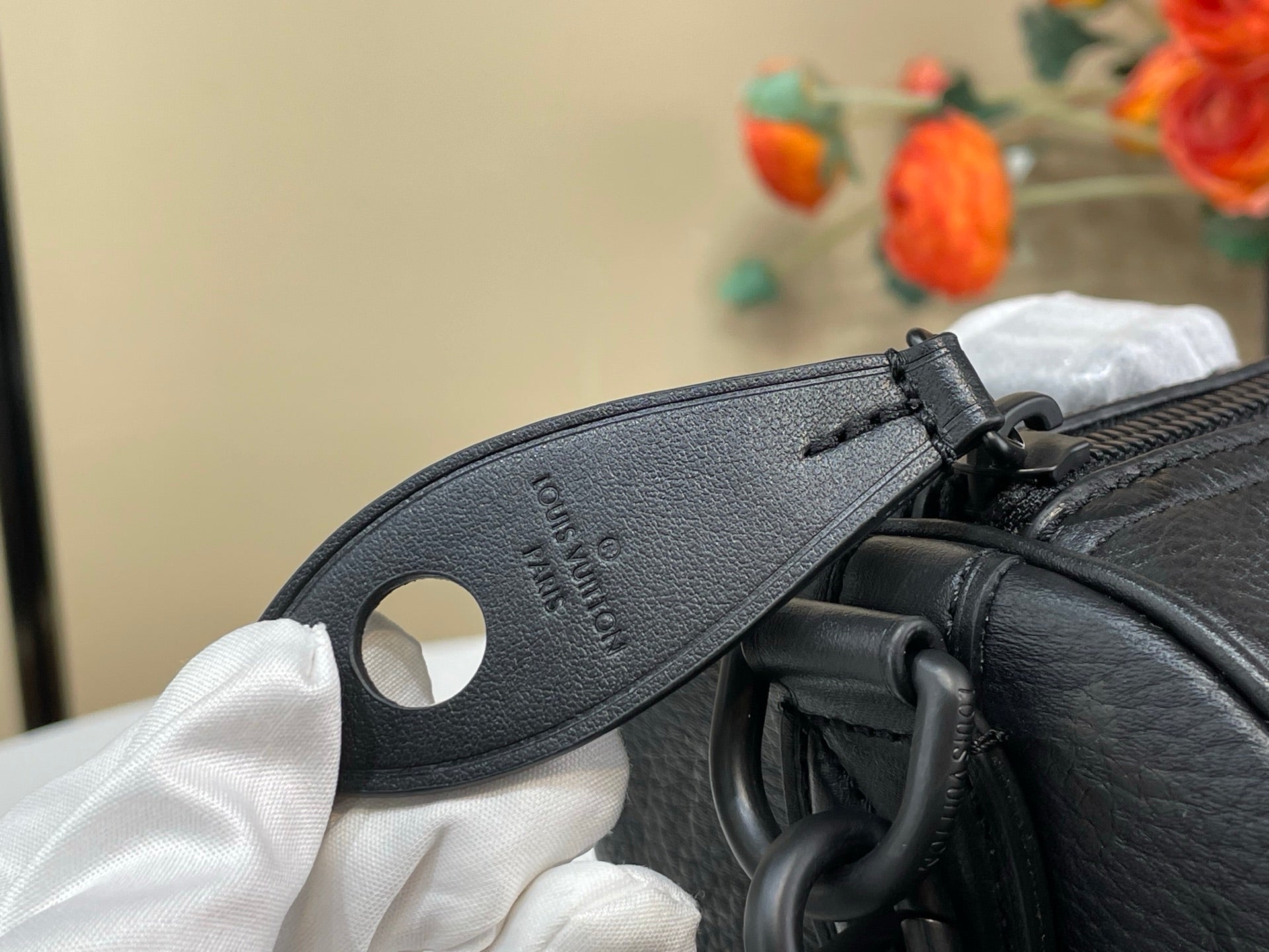 Louis Vuitton bag leather zipper pull with embossed logo patch