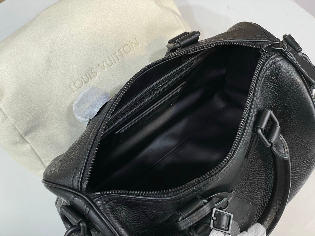 Louis Vuitton bag open top with black leather interior and zipper closure