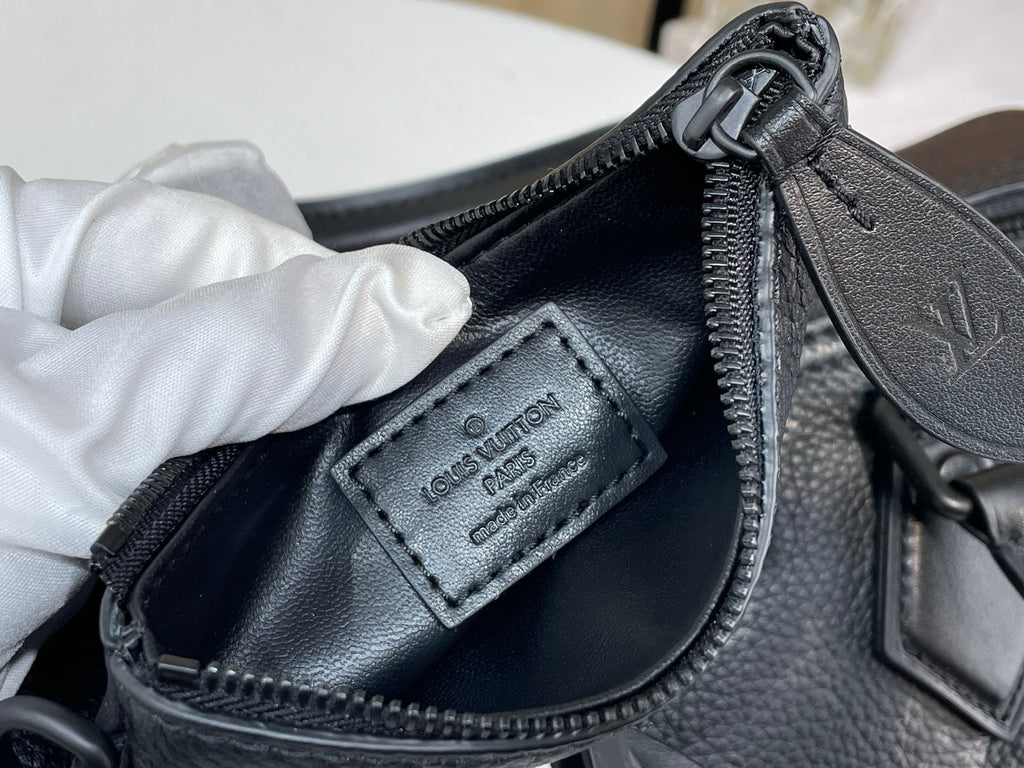 Louis Vuitton bag front leather patch with zip and hardware