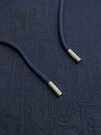 Navy blue hoodie front zipper with gold-tone zipper pulls
