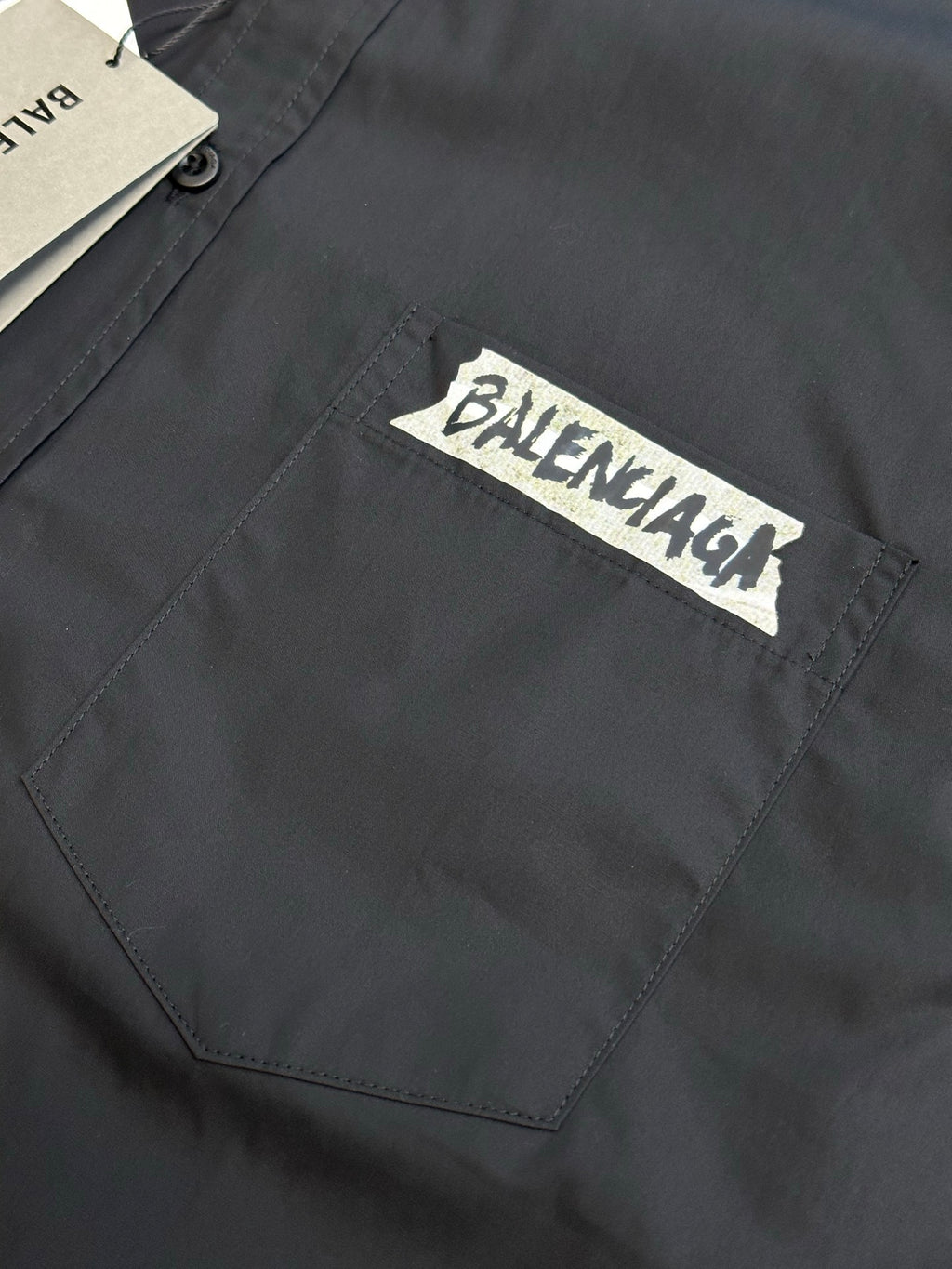Balenciaga shirt chest pocket with stitched detail and white logo label