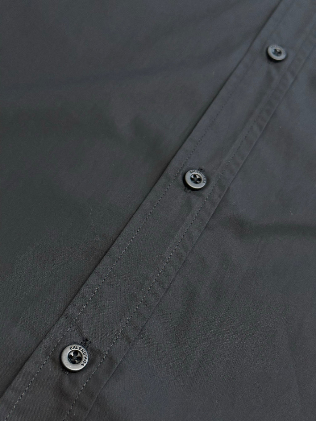 Balenciaga long-sleeve shirt with dark buttons and contrast stitching