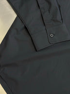 Balenciaga long-sleeve shirt cuff with buttoned placket and folded edge