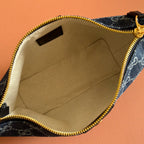 Gucci bag interior with beige lining and gold zipper trim