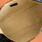 Gucci bag interior with beige fabric lining and zipper edge trim.
