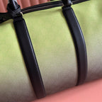 Lime and dark duffel bag with black leather strap detail and stitched seams