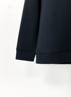 Black crewneck sweatshirt hem and sleeve cuffs detail