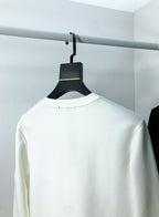 White sweatshirt back view with small neckline tag on hanger