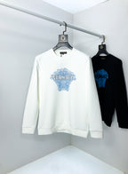 White crewneck sweatshirt with blue Versace logo graphic front on hanger