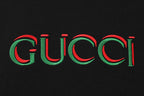 Black T-shirt chest graphic: multicolor Gucci logo in red and green