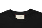 Black crew-neck T-shirt with Gucci neck label at the collar