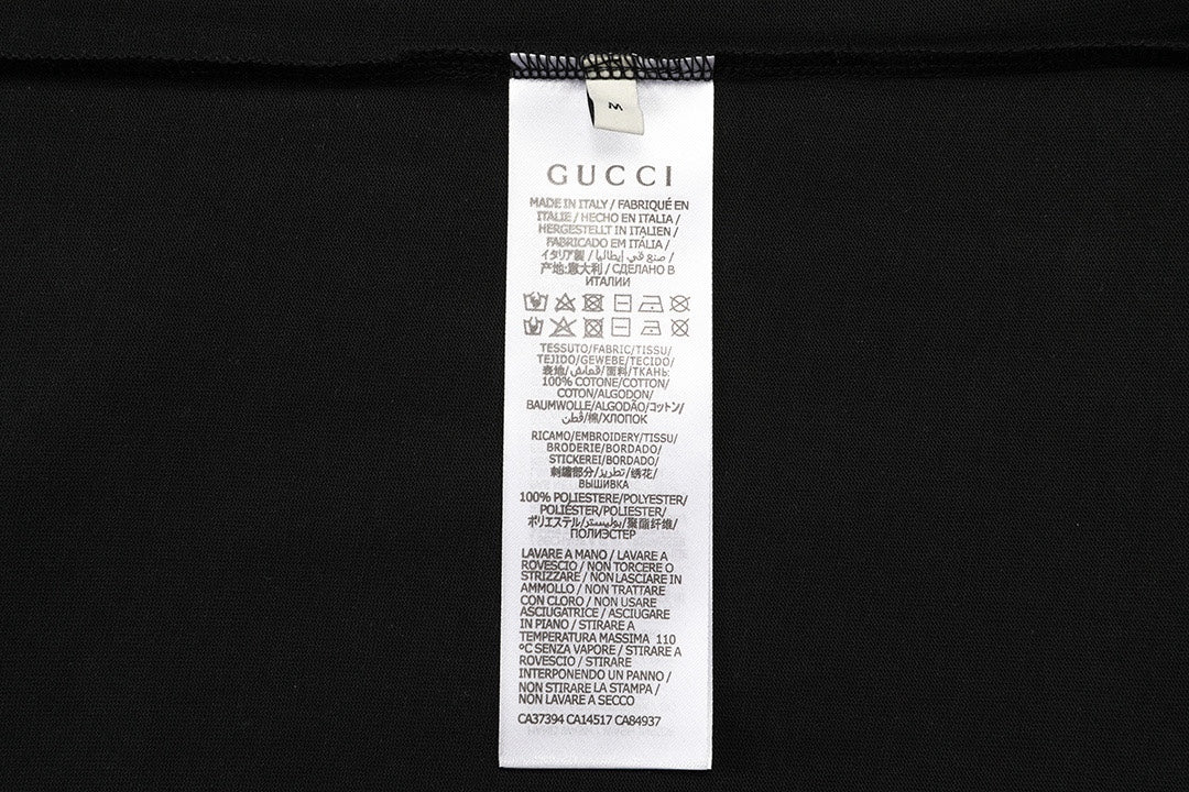Gucci black shorts care label