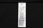 Black shorts care label with GUCCI text