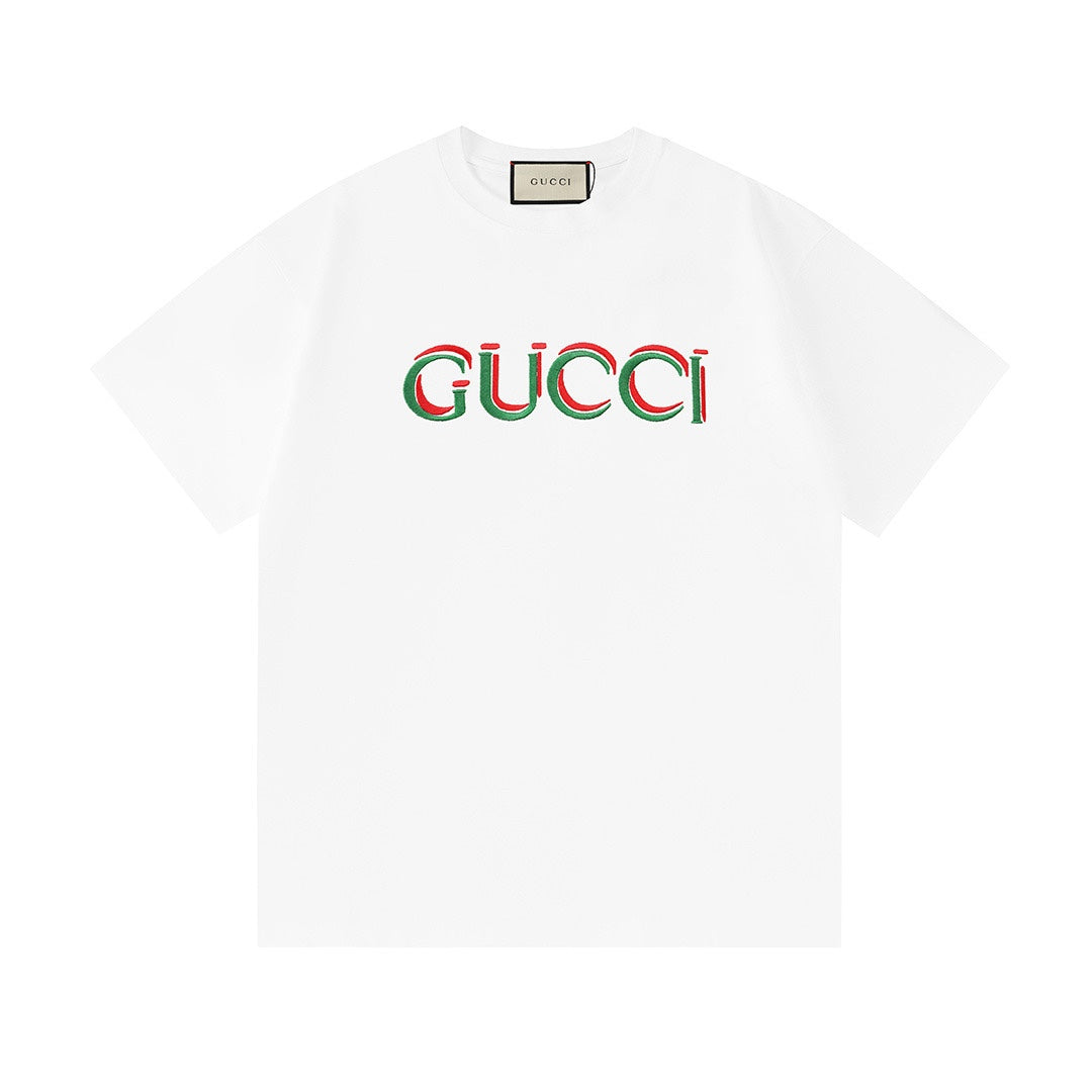 White short-sleeve T-shirt with Gucci logo print at center front