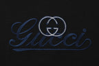 Black T-shirt with large blue Gucci logo embroidery and heart emblem