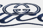 Gucci T-shirt logo emblem detail in blue on white fabric