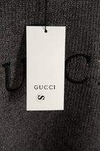 Dark gray knit sweater size tag marked S